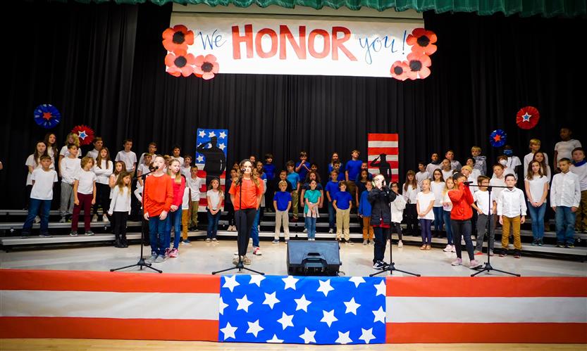Students sing in Veterans Day performance